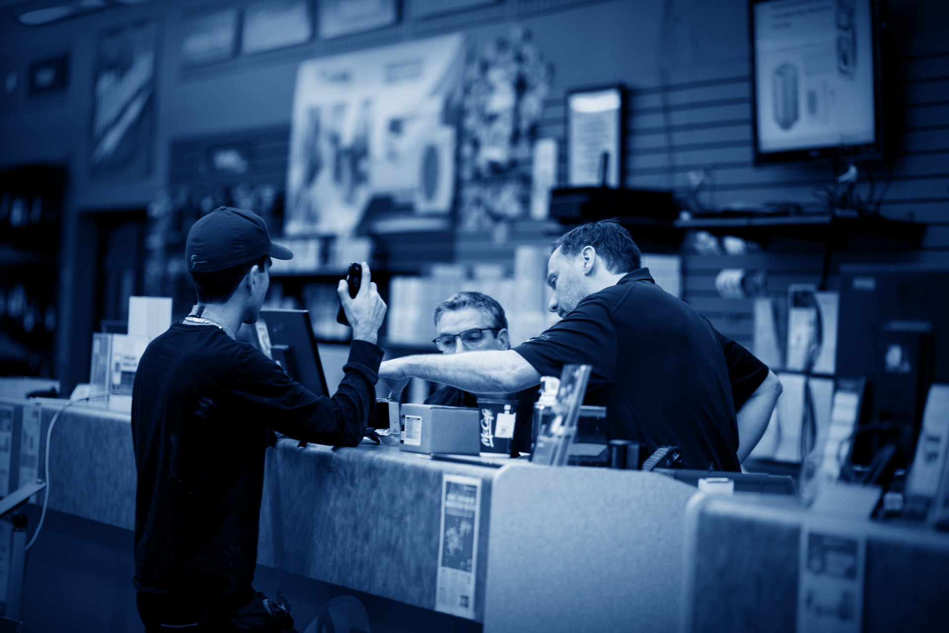rsl sales associates assisting customer at counter